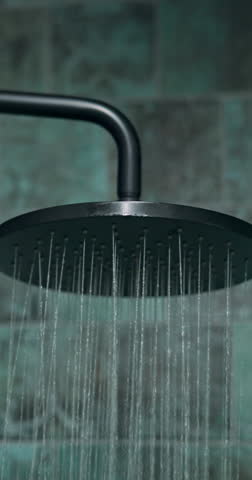 Hygiene, shower and water for cleaning in bathroom of home, hotel or resort to relax or wash. Hot, skincare and wellness with flow or spray in luxury apartment for accommodation and hospitality