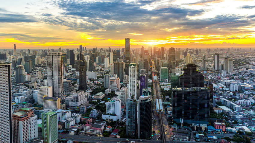 Aerial view of Traffic and skyscraper at sunrise in Bangkok, Thailand.