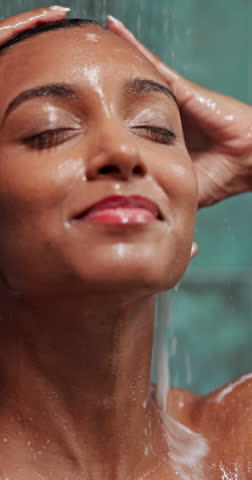Home, woman and shower with cosmetics for hair care, cleaning and keratin treatment for wellness. Bathroom, female person and water with shampoo for hydration, growth and washing for hygiene in house