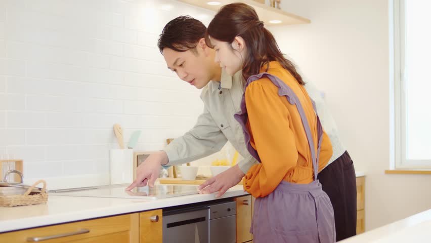A worker repairing an induction cooker