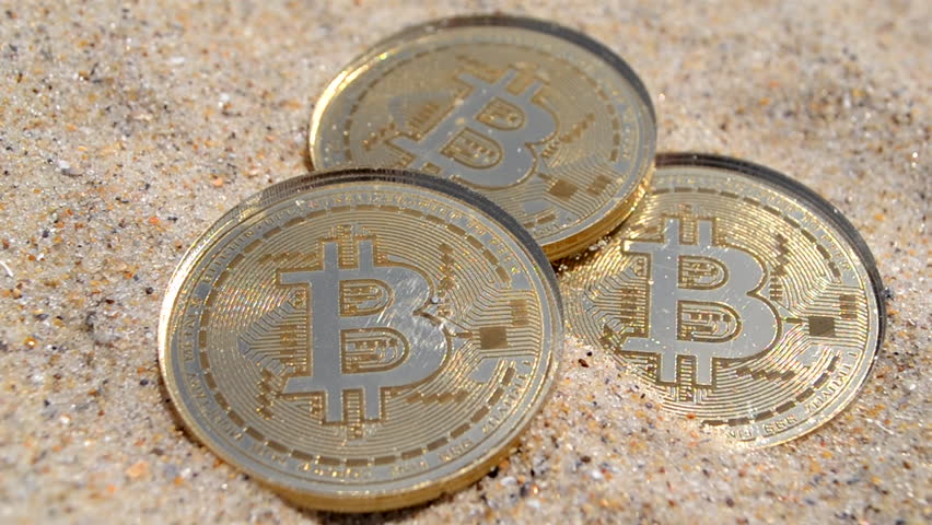 Bitcoin coins in sand close up. Three Bitcoin coins sprinkled with sand on sunny day close-up. Concept cryptocurrency web 3 cryptocurrencies crypto bit coin digital finance money virtual cryptography