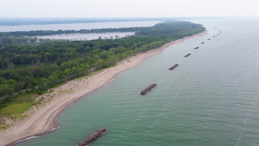 Presque Isle from a drone’s perspective—soaring over the sandy beaches, the endless blue of Lake Erie, and the lush forests that make this park so unique.