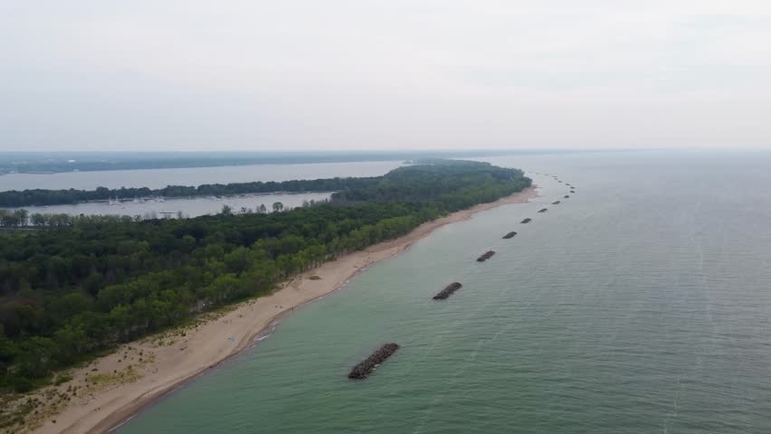 Aerial views of Presque Isle reveal golden sands, gentle waves of Lake Erie, and green forests wrapping around this stunning Pennsylvania state park