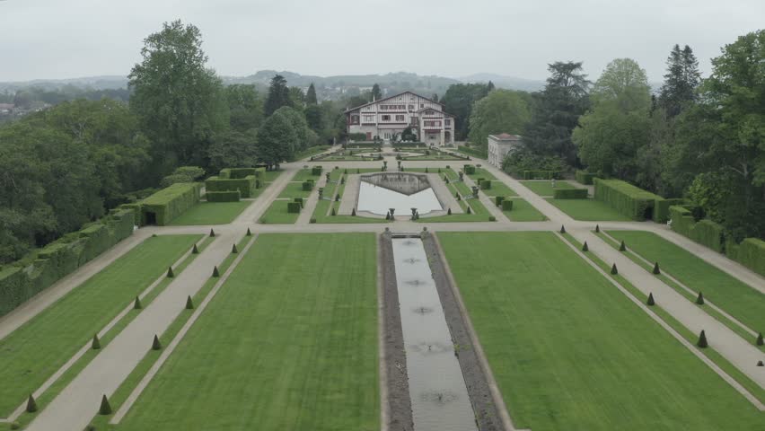House-museum of Edmond Rostand, luxury estate of countryside, Villa Arnaga, Cambo-les-Bains in Pyrenees Atlantiques, France. Aerial forward