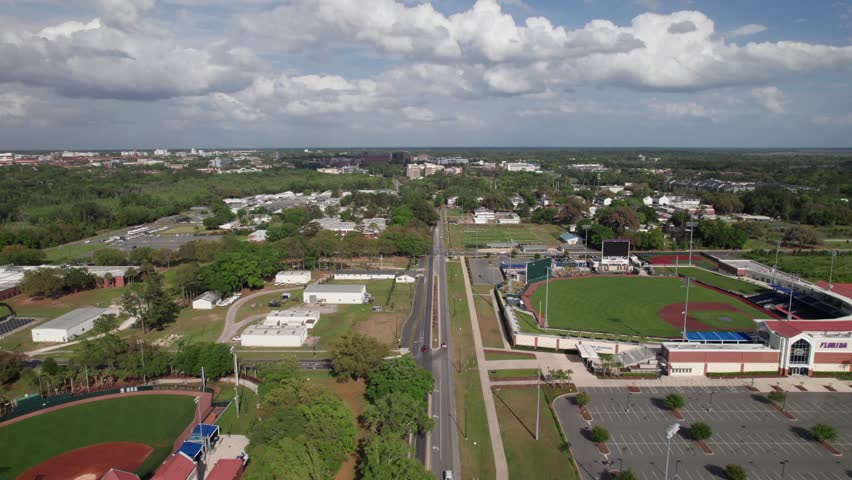 Aerial view of University of Florida campus with NCAA baseball stadiums, 4K