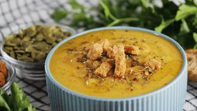 Creamy vegetable soup with spices and rusks, chef tastes soup with a spoon. High quality 4k footage - Powered by Shutterstock - Get 15% off with code: PIKWIZARD15