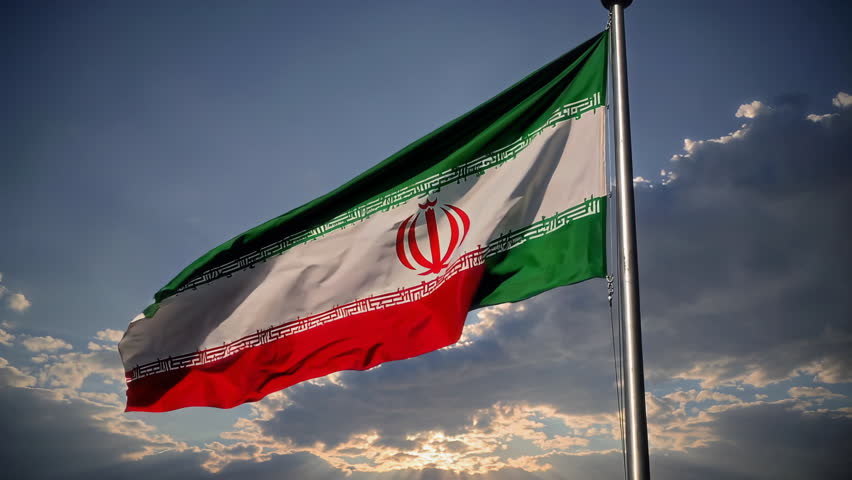 The beautiful Iranian flag flutters proudly in the gentle breeze, set against a picturesque cloudy backdrop