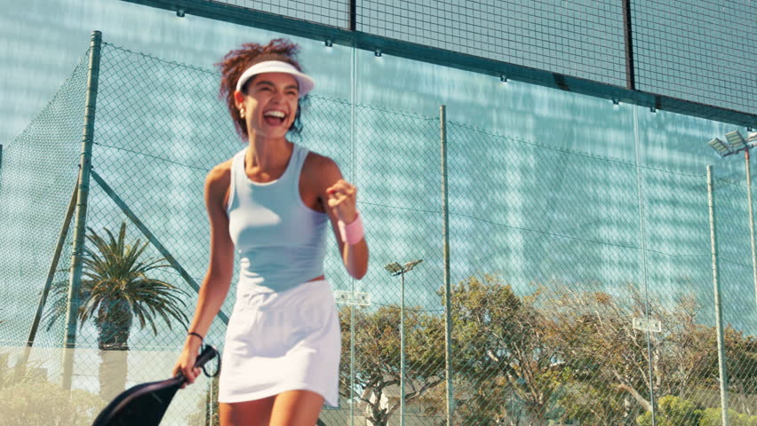 Padel tennis, winner and fist pump with woman on court for competition, training and performance. Game, sports workout and fitness club with person in match for athlete, exercise or racket tournament