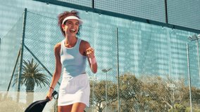 Padel tennis, winner and fist pump with woman on court for competition, training and performance. Game, sports workout and fitness club with person in match for athlete, exercise or racket tournament - Powered by Shutterstock - Get 15% off with code: PIKWIZARD15