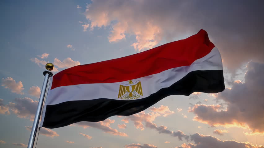 The Egyptian flag gracefully waves amidst a beautifully picturesque sky backdrop, creating a striking scene