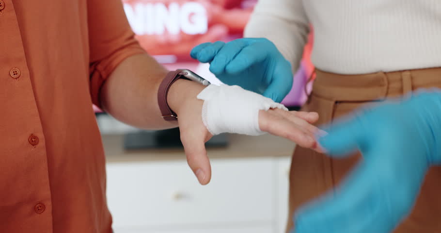 Paramedic, hands or bandage with first aid training for injury, mobility or emergency service at office. Closeup, medical or strap with cotton or patient accident for bruise, wound or healthcare