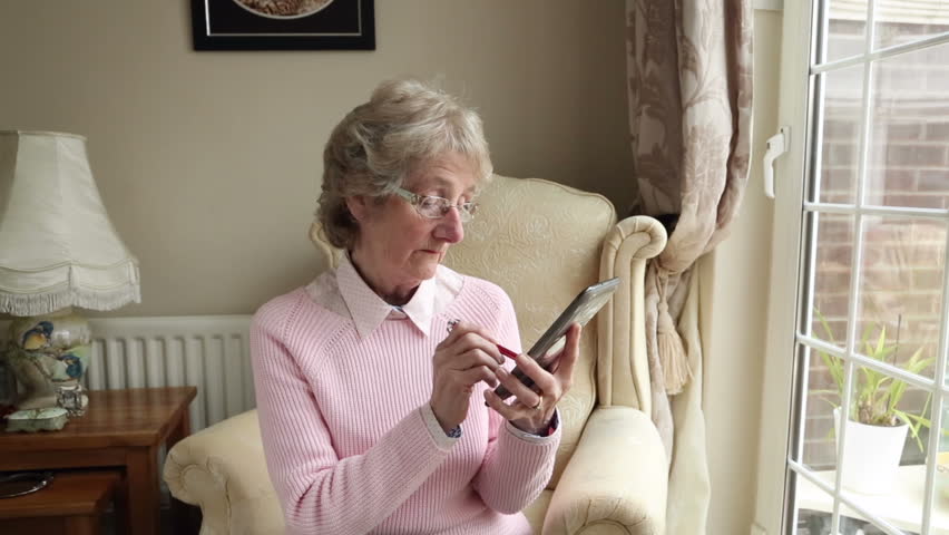 Senior woman sending text or email using tablet at home | Shutterstock HD Video #3765050