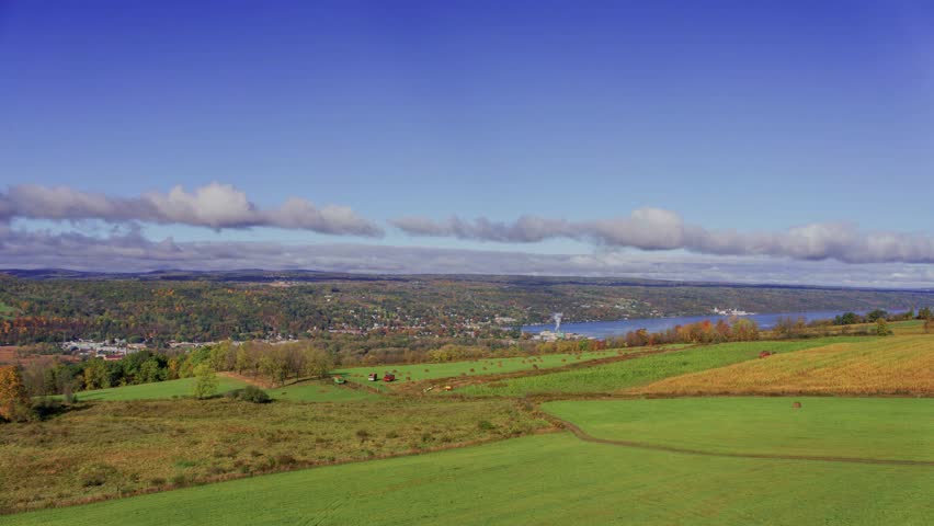 Stunning 4K drone footage capturing the scenic beauty of Watkins Glen and the Finger Lakes region in autumn, with vibrant fall foliage under cloudy skies.