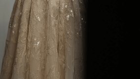 A beautiful wedding dress with a long, lace-trimmed train is displayed on a mannequin. The scene is decorated with flowers and ornate pedestals, creating a romantic atmosphere. - Powered by Shutterstock - Get 15% off with code: PIKWIZARD15