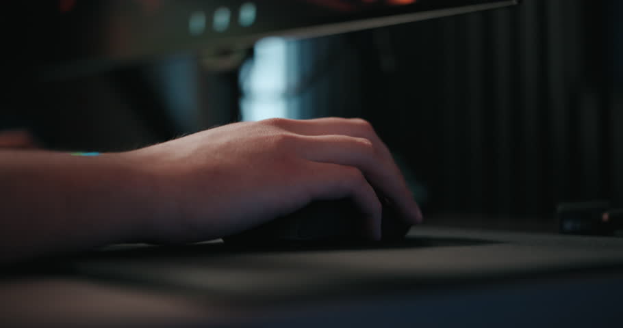 Video game live streamer’s hands moving a keyboard and mouse