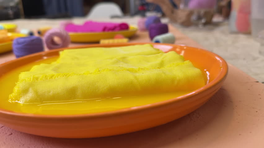 top view of flasks with dyed fabrics in bright colors fabric master class concept