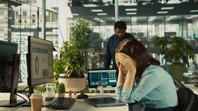 Accountant in busy modern startup agency imputing financial figures on PC after checking reports. Focused businesswoman working in modern office, crosschecking data, camera B - Powered by Shutterstock - Get 15% off with code: PIKWIZARD15