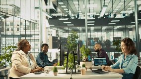 Happy employee starting first day at new job, unpacking belongings, meeting coworkers. Cheerful worker arriving in office, starting work on new company position, being welcomed by team, camera B - Powered by Shutterstock - Get 15% off with code: PIKWIZARD15