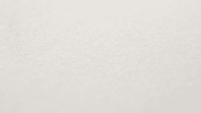 Close up of an antique calligraphy pen nib writing a thick black line. Slow motion of a classic vintage fountain pen drawing a curvy line with ink absorbed by the parchment paper. - Powered by Shutterstock - Get 15% off with code: PIKWIZARD15