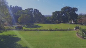 Digital connections and icons forming network over green landscape with trees. Technology, connectivity, nature, innovation, networking, environment - Powered by Shutterstock - Get 15% off with code: PIKWIZARD15