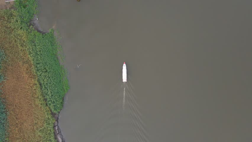 Boat passes control post dock in Pacaya Samiria National Reserve, Loreto Peru, slow cruise