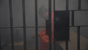 Prison scene man in jail cell african american drug charges - Powered by Shutterstock - Get 15% off with code: PIKWIZARD15