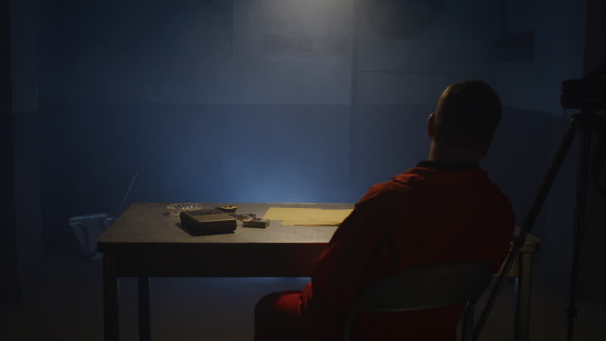 Inmate being questioned in empty room by police