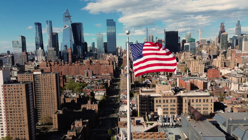 Skyline of new york city with american flag
