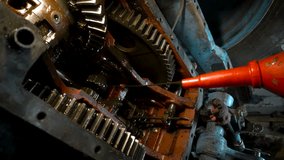 repair of an old blue tractor in a vintage garage, dismantling and installation of a gearbox, replacement of bearings - Powered by Shutterstock - Get 15% off with code: PIKWIZARD15