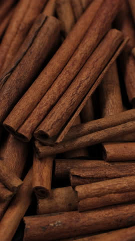 Macro Heap of cinnamon sticks close up, rotation