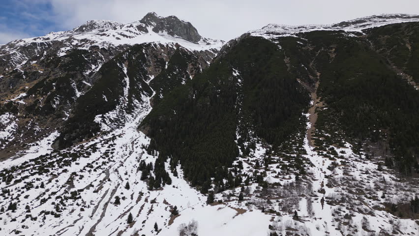 Rocky mountains and snow in Austria, aerial view