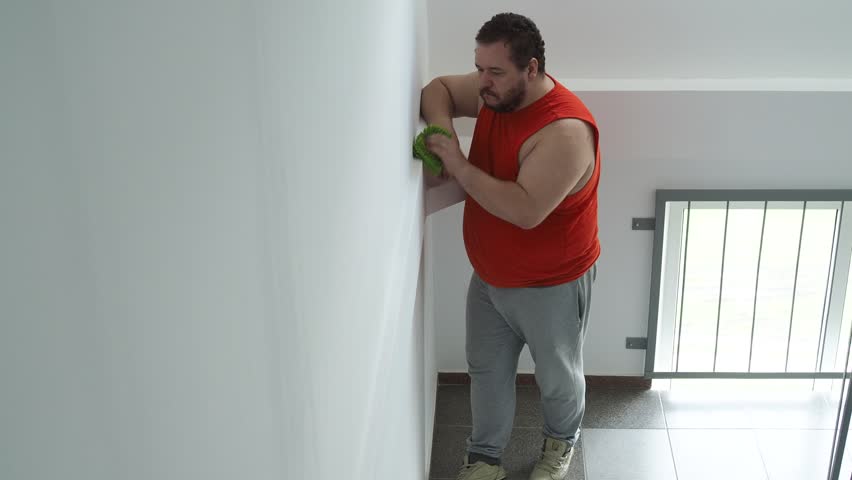 A man is cleaning the entrance