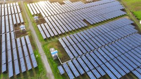 The drone captures the vast expanse of a solar farm, symbolizing the growing trend of investing in renewable energy infrastructure as a key component of sustainable economic growth.
 - Powered by Shutterstock - Get 15% off with code: PIKWIZARD15