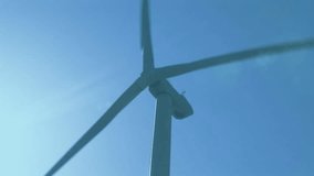 Wind turbine with animation of data graphs overlaying blue sky background. Renewable, energy, technology, infographic, sustainability, clean - Powered by Shutterstock - Get 15% off with code: PIKWIZARD15