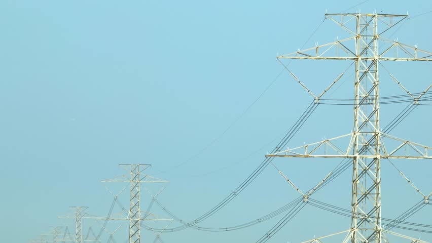 The detailed structure of a steel power transmission tower, showing the intricate network of cables that connect power stations to homes and businesses.

