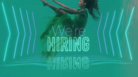 Underwater, person surrounded by glowing arrows and We're Hiring animation text. Recruitment, job search, employment, technology, digital, innovation - Powered by Shutterstock - Get 15% off with code: PIKWIZARD15