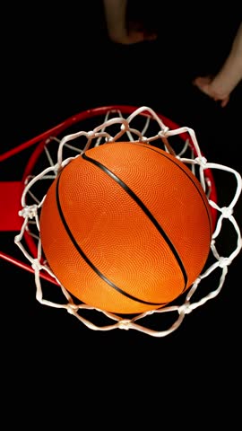 Super Slow Motion of Basketball Player Throwing the Ball and Hitting the Basket. Filmed on High Speed Cinema Camera, 1000fps. 