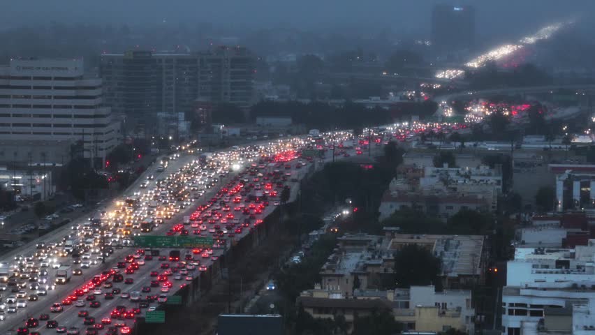 Telephoto drone shot of rush hour traffic, blue hour in Westwood, Los Angeles