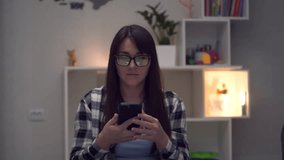 Money Rain. Online winning. Cash flow, dollar bills floating on woman. Happy Young millennial woman with smartphone earns online income at home. Slow Motion - Powered by Shutterstock - Get 15% off with code: PIKWIZARD15