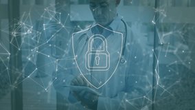 Using tablet with digital security lock animation, doctor in hospital setting. Technology, cybersecurity, healthcare, medicine, innovation, protection - Powered by Shutterstock - Get 15% off with code: PIKWIZARD15