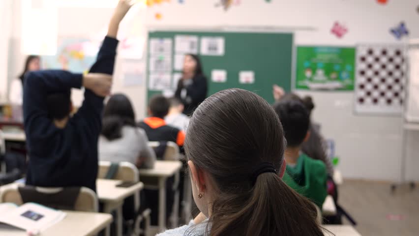 School children are participating actively in class. Education - Powered by Shutterstock - Get 15% off with code: PIKWIZARD15