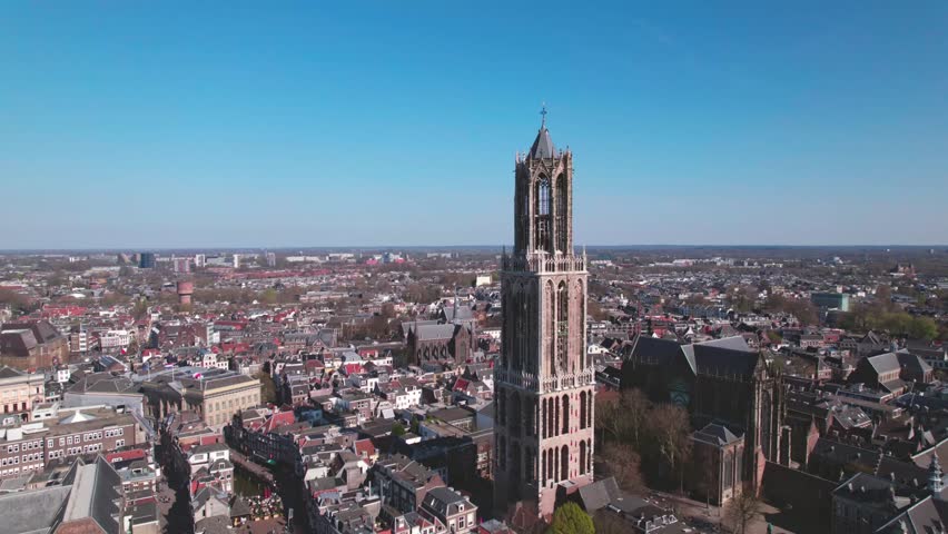 Aerial drone view of typical Dutch city skyline, Utrecht cityscape with renovated Dom tower, canals and houses, Holland, Netherlands