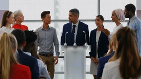 Applauding diverse team in business meeting with geometric animation overlay. Teamwork, collaboration, diversity, corporate, brainstorm, innovation - Powered by Shutterstock - Get 15% off with code: PIKWIZARD15