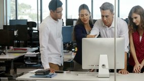 Collaborating at computer, business team with clock animation overlay in office. Teamwork, collaboration, technology, time management, innovation, productivity - Powered by Shutterstock - Get 15% off with code: PIKWIZARD15