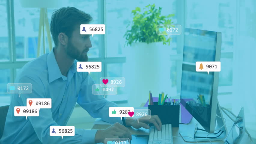 Working at desk, man receiving social media notifications overlaying computer screen. Technology, multitasking, digital, office, communication - Powered by Shutterstock - Get 15% off with code: PIKWIZARD15