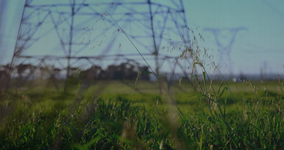 Power lines in field with data charts and graphs overlay animation. Technology, electricity, infrastructure, analytics, smart grid, visualization