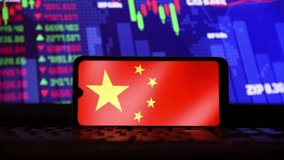 Chinese flag on a cell phone screen, and random stock market charts are shown in the background. Concept of economy, crisis, stock market and financial market. - Powered by Shutterstock - Get 15% off with code: PIKWIZARD15