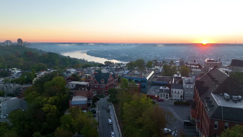 Aerial Sunrise Over Cincinnati Ohio River and Skyline Church Tracking Shot