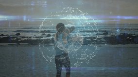Interacting with digital network interface, person standing on beach with animation. Technology, innovation, connectivity, creative, interactive, virtual - Powered by Shutterstock - Get 15% off with code: PIKWIZARD15