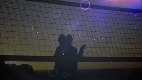 Playing volleyball, silhouetted people in animation with digital data lines overlay. Sport, teamwork, futuristic, network, connection, technology - Powered by Shutterstock - Get 15% off with code: PIKWIZARD15